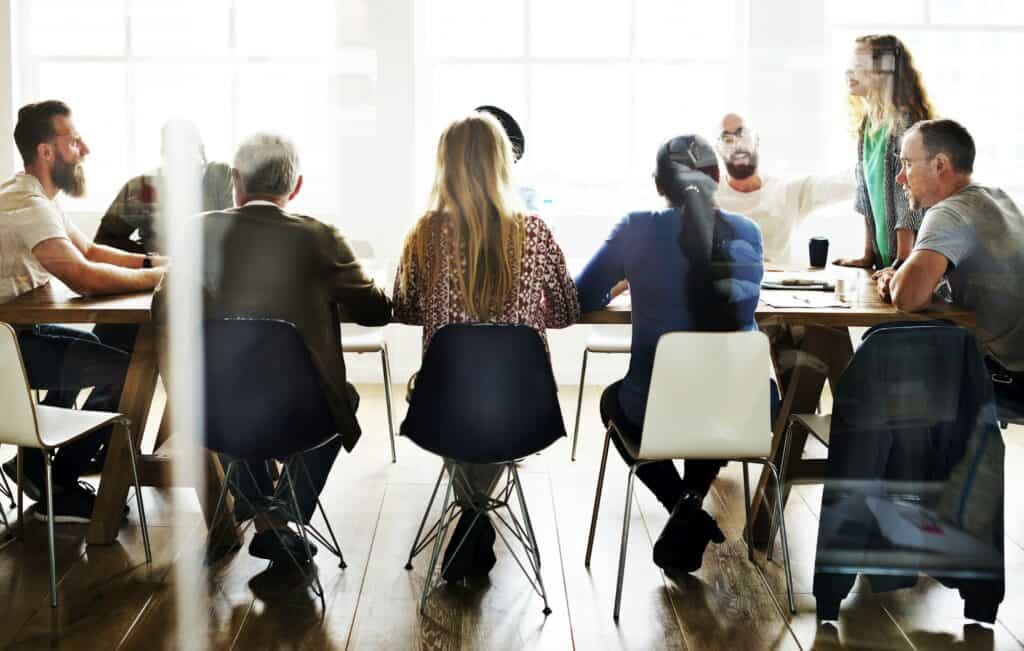 Three Effective Ways to Collaborate with Another Professional 1 Meeting Table Networking Sharing Concept